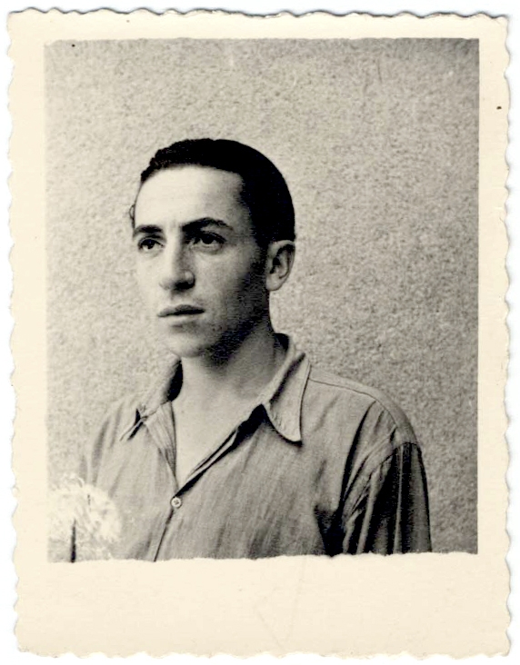 Black-and-white square-shaped photograph with a Polaroid border of a young man looking towards the left of the camera. His hair is combed back and he wears a collared shirt.