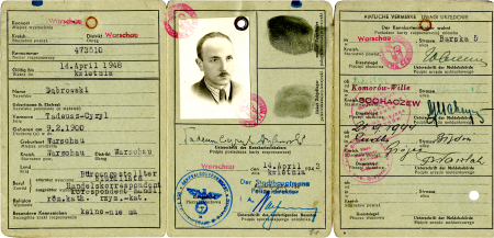Copy of an unfolded identity document, split in three pages. The pages include red and blue stamps, typed and handwriting information, as well as two black fingerprints. The middle page has a black-and-white identity photograph of a man with a moustache, wearing a suit.